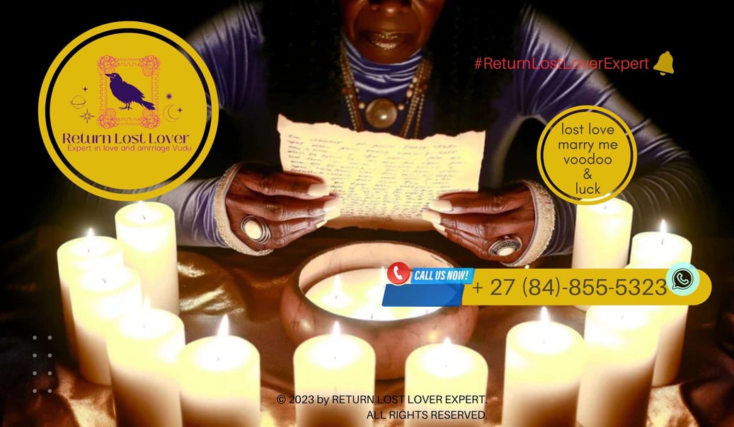 A candlelit altar with a written love intention placed beneath a rose quartz crystal.