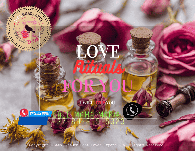 Bottles of rose and ylang ylang oils with dried flowers for love magic.